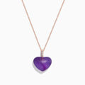 The 14K Rose Gold Amethyst and Diamond Heart Pendant (10.32 TCW) features a heart-shaped amethyst center with a vertical row of sparkling diamonds above, displayed on a rose gold chain against a white background.
