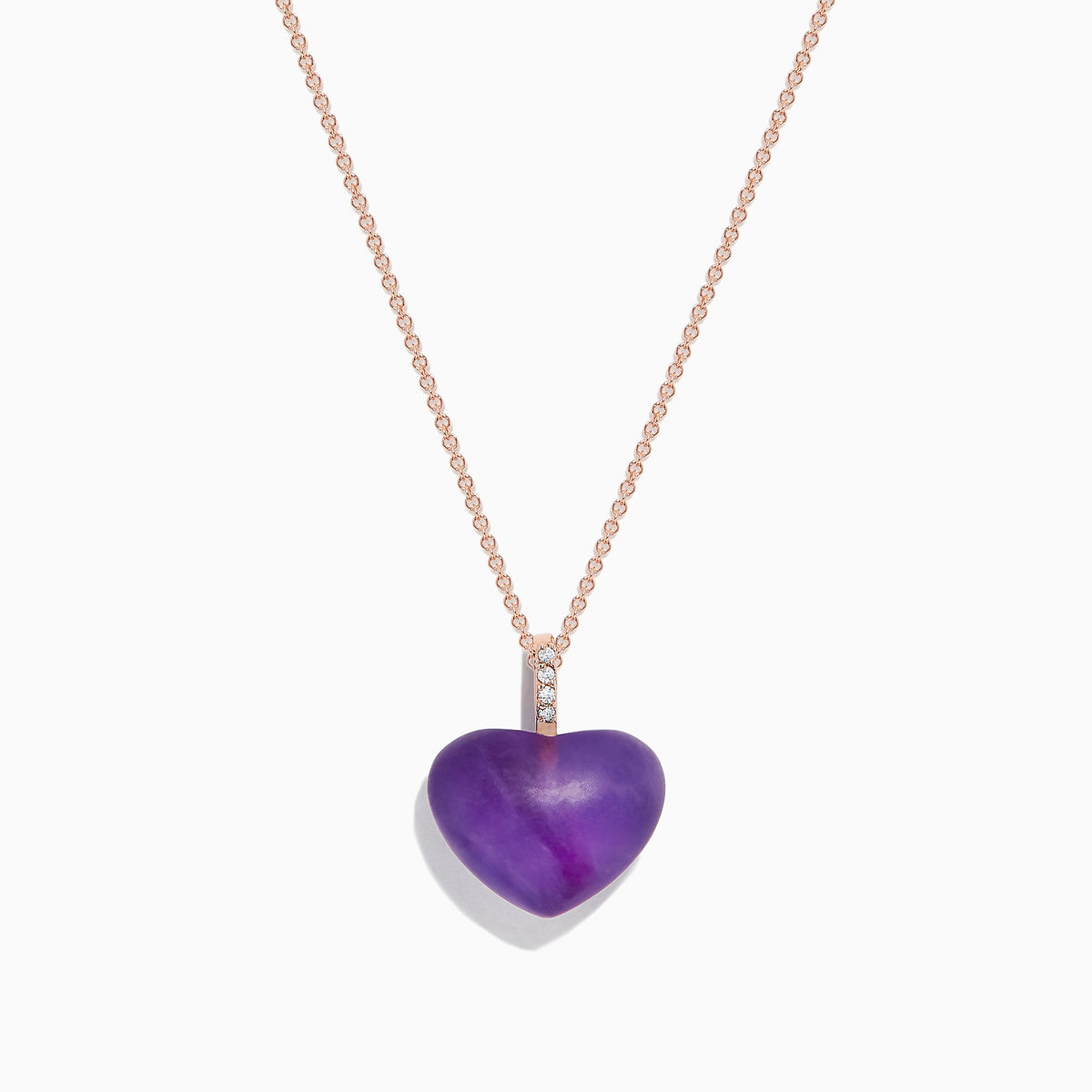 The 14K Rose Gold Amethyst and Diamond Heart Pendant (10.32 TCW) features a heart-shaped amethyst center with a vertical row of sparkling diamonds above, displayed on a rose gold chain against a white background.