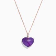 The 14K Rose Gold Amethyst and Diamond Heart Pendant (10.32 TCW) features a heart-shaped amethyst center with a vertical row of sparkling diamonds above, displayed on a rose gold chain against a white background.