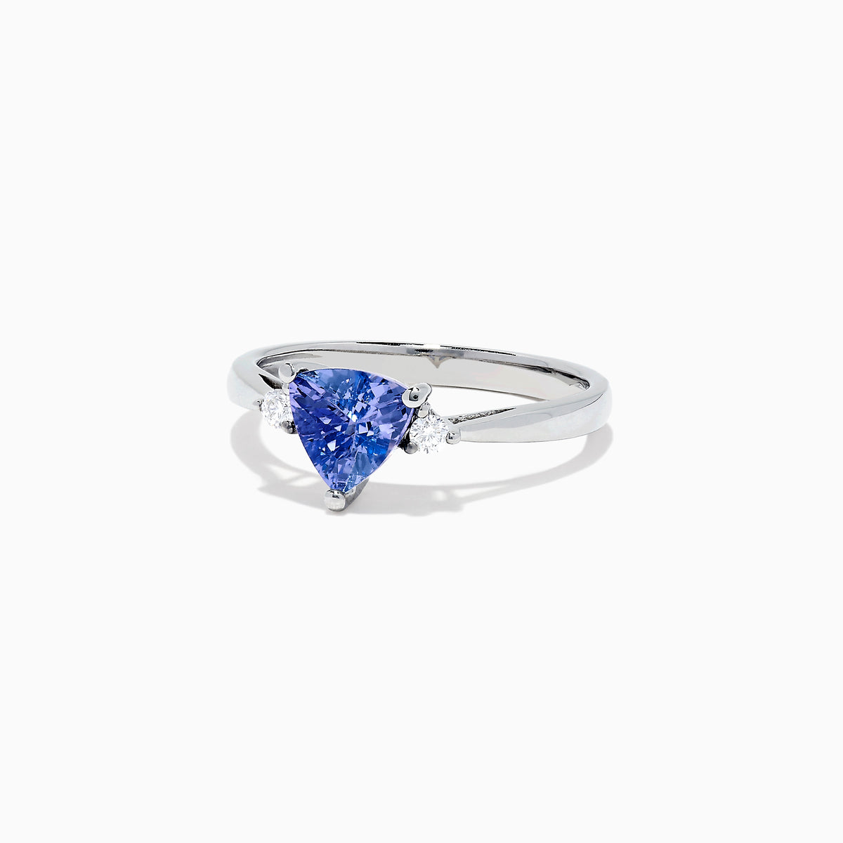The Nahla Siri 14K White Gold Trillion Tanzanite and Diamond Ring, 1.07 TCW, features a triangular-cut tanzanite center accented by two round diamonds, shown on a white background.