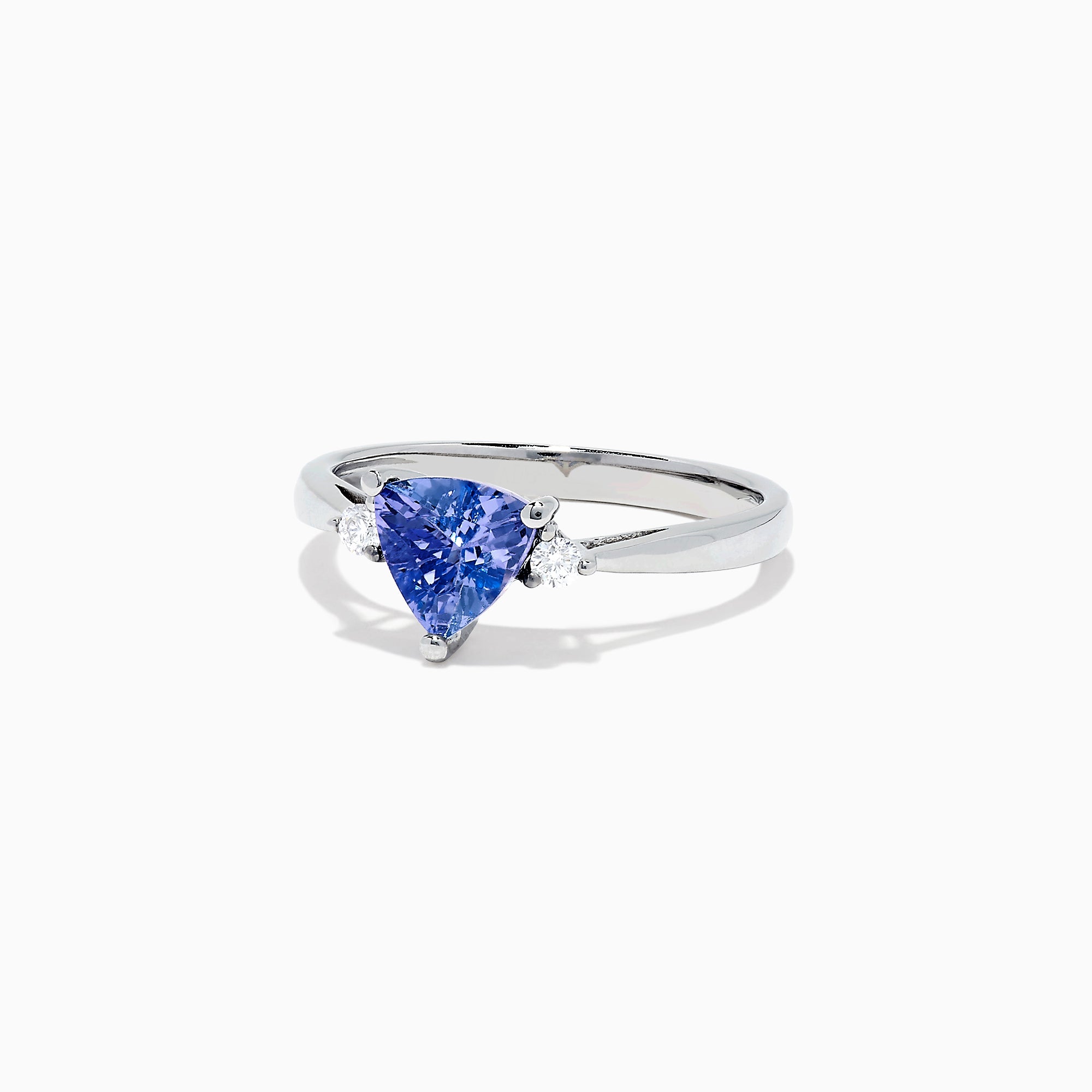 The Nahla Siri 14K White Gold Trillion Tanzanite and Diamond Ring, 1.07 TCW, features a triangular-cut tanzanite center accented by two round diamonds, shown on a white background.