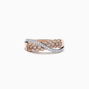 The 14K Two Tone Gold Brown and White Diamond Crossover Ring, 1.00 TCW, showcases a wave-inspired design with clusters of brown and white diamonds in two rows, blending modern elegance and timeless sparkle.
