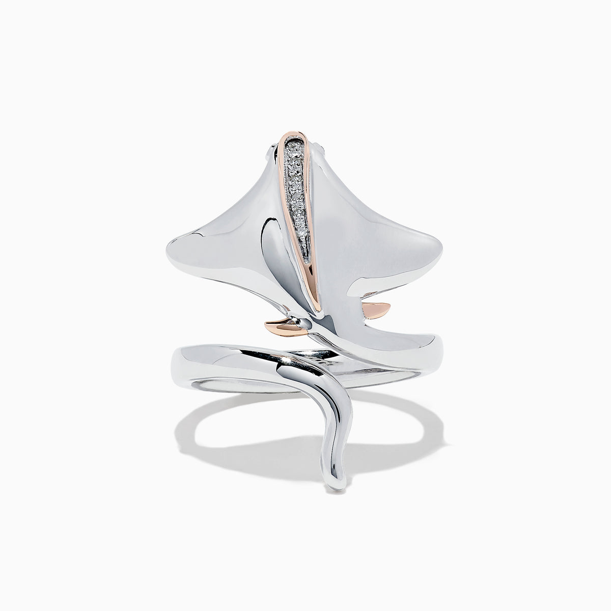 The 925 Sterling Silver & 14K Gold Diamond Stingray Wrap Ring features a flowing stingray design with 0.03 TCW diamonds and rose gold accents, its sculptural band elegantly curving to mimic the graceful movement of a stingray.