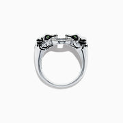 The Signature Sterling Silver Diamond Panther Ring, 0.09 TCW, features two panther heads with green gemstone eyes gripping a diamond-set circle in their mouths—an elegant and detailed design against a white backdrop.