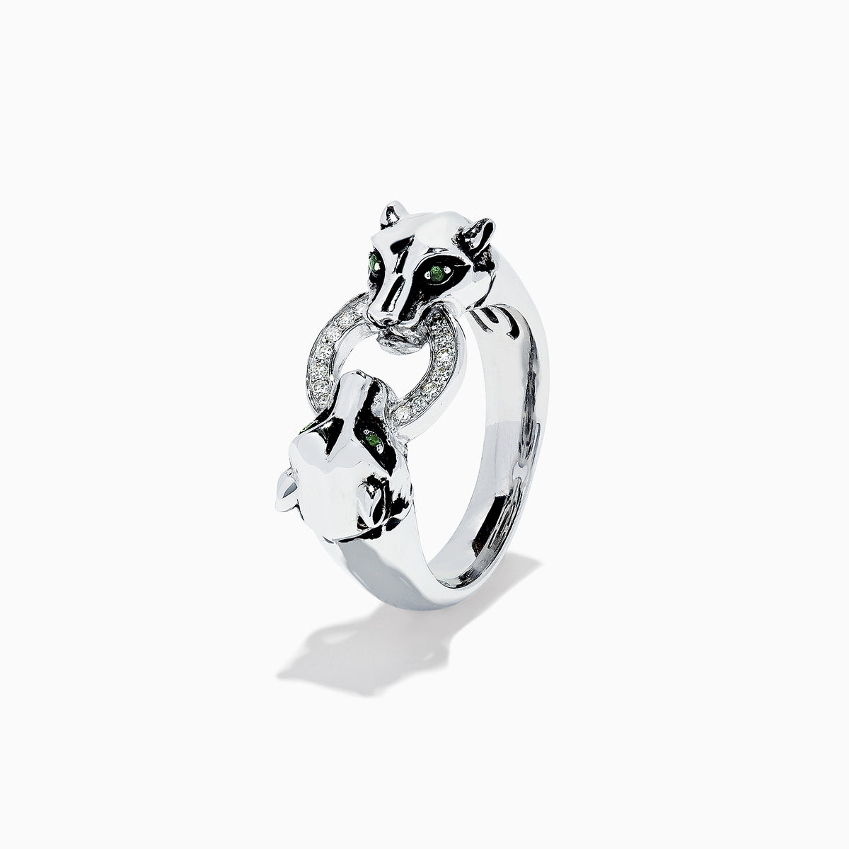 The Signature Sterling Silver Diamond Panther Ring, 0.09 TCW, features two panther heads with green gemstone eyes gripping a diamond-set circle in their mouths—an elegant and detailed design against a white backdrop.