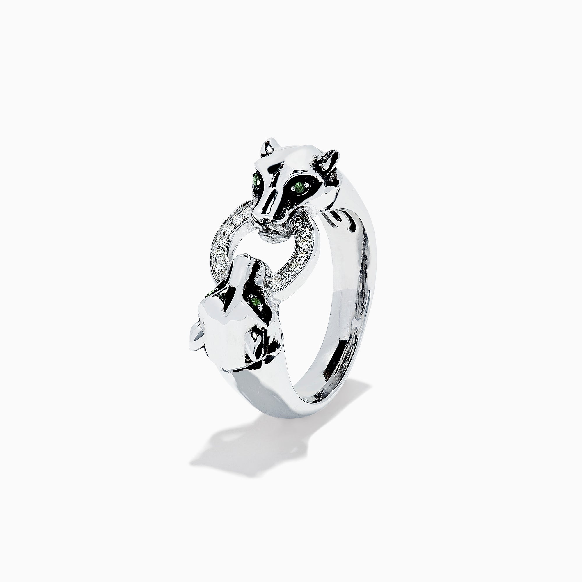 The Signature Sterling Silver Diamond Panther Ring, 0.09 TCW, features two panther heads with green gemstone eyes gripping a diamond-set circle in their mouths—an elegant and detailed design against a white backdrop.