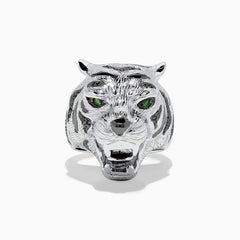 The Sterling Silver Black Diamond and Tsavorite Tiger Ring, 0.21 TCW, features a tiger’s head design with detailed fur, black diamonds, and vivid green Tsavorite eyes, displayed against a white background.