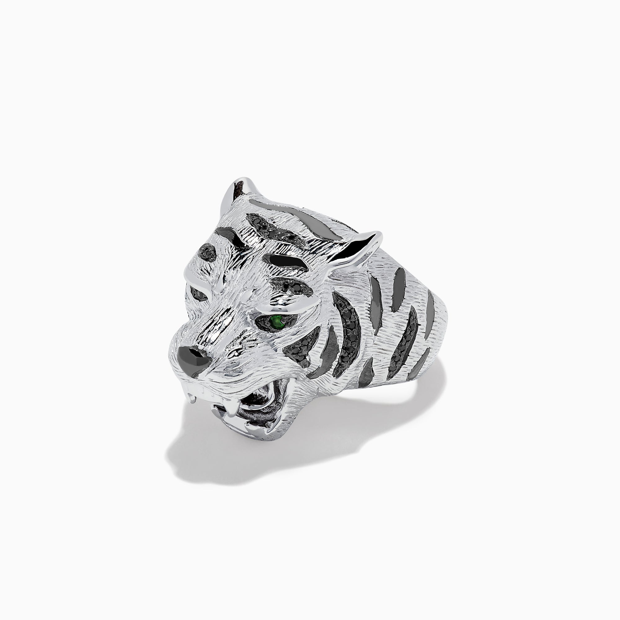 The Sterling Silver Black Diamond and Tsavorite Tiger Ring, 0.21 TCW, features a tiger’s head design with detailed fur, black diamonds, and vivid green Tsavorite eyes, displayed against a white background.