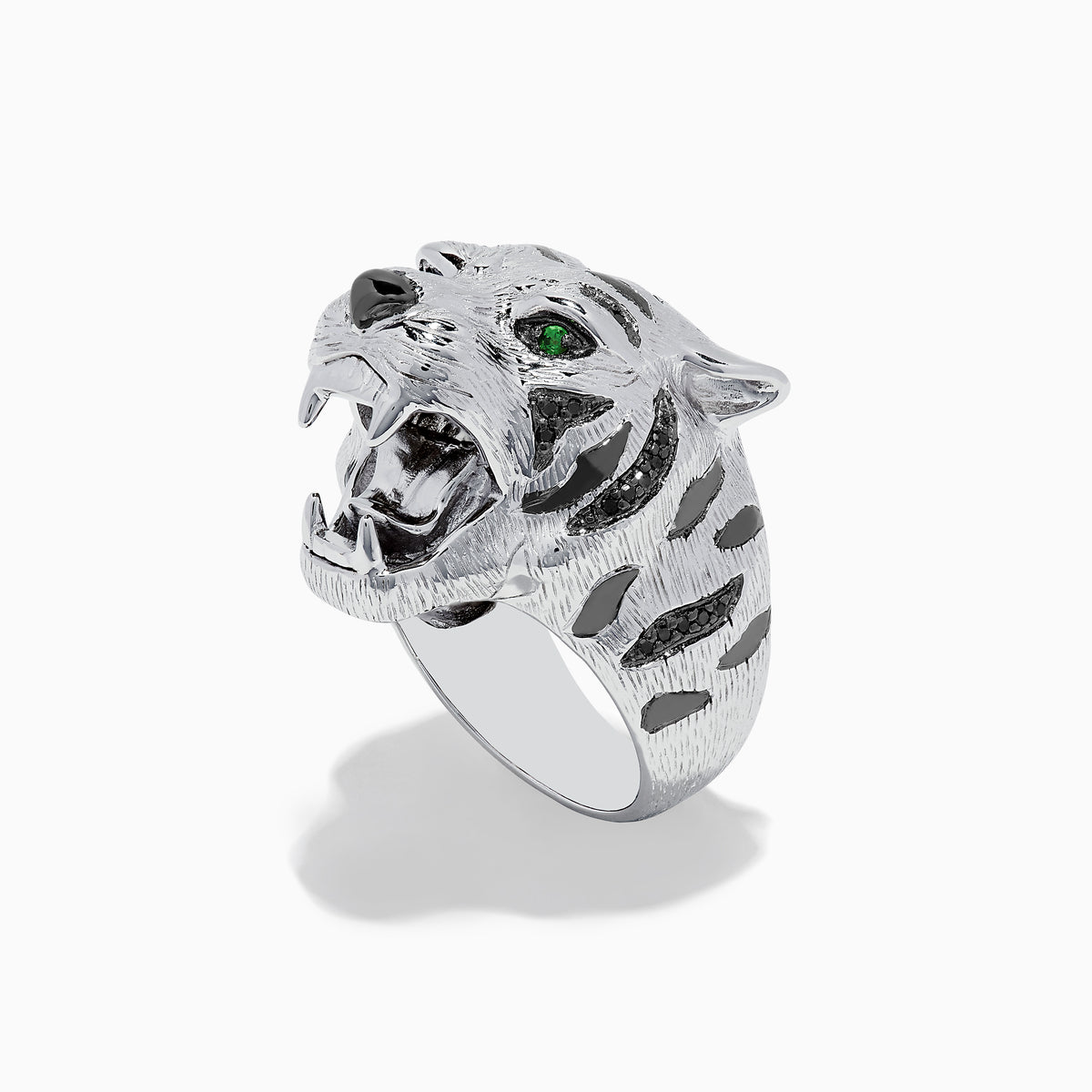 The Sterling Silver Black Diamond and Tsavorite Tiger Ring, 0.21 TCW, features a tiger’s head design with detailed fur, black diamonds, and vivid green Tsavorite eyes, displayed against a white background.