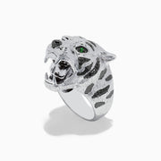 The Sterling Silver Black Diamond and Tsavorite Tiger Ring, 0.21 TCW, features a tiger’s head design with detailed fur, black diamonds, and vivid green Tsavorite eyes, displayed against a white background.