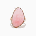 The 14K Rose Gold Pink Opal and Diamond Ring showcases a large, asymmetrical pink opal accented with small diamonds on a simple rose gold band, displayed against a white background.