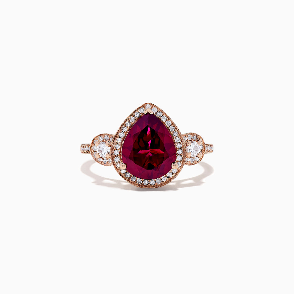 The Bordeaux 14K Rose Gold Rhodolite Garnet and Diamond Ring (3.32 TCW) features a pear-shaped Rhodolite Garnet, diamond halo, and round diamond clusters on each side, all set on a rose gold band.