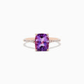 The 14K Rose Gold Amethyst and Diamond Ring, 2.21 TCW, showcases a large cushion-cut amethyst centerpiece with small round diamonds on the band, displayed against a white background.