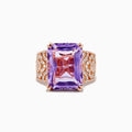 The Amethyst 14K Rose Gold Amethyst and Diamond Ring features a large rectangular amethyst center, accented by intricate rows of sparkling diamonds set into its wide rose gold band.
