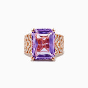 The Amethyst 14K Rose Gold Amethyst and Diamond Ring features a large rectangular amethyst center, accented by intricate rows of sparkling diamonds set into its wide rose gold band.