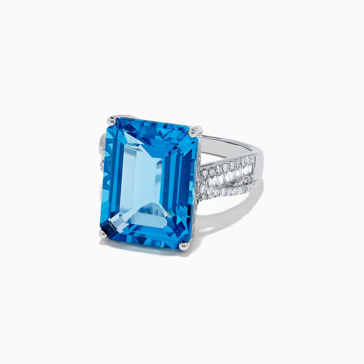 The Ocean Bleu 14K White Gold Blue Topaz and Diamond Ring, 13.65 TCW, showcases a large emerald-cut blue topaz with side baguette diamonds on a white gold band, set against a plain white background.
