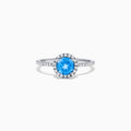 The Ocean Bleu 14K White Gold Blue Topaz and Diamond Ring, 1.12 TCW, showcases a round blue topaz center with a diamond halo and diamonds on the band.