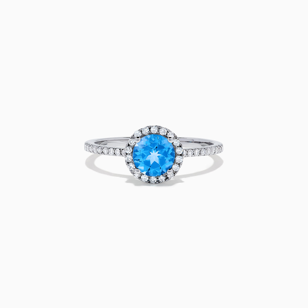 The Ocean Bleu 14K White Gold Blue Topaz and Diamond Ring, 1.12 TCW, showcases a round blue topaz center with a diamond halo and diamonds on the band.
