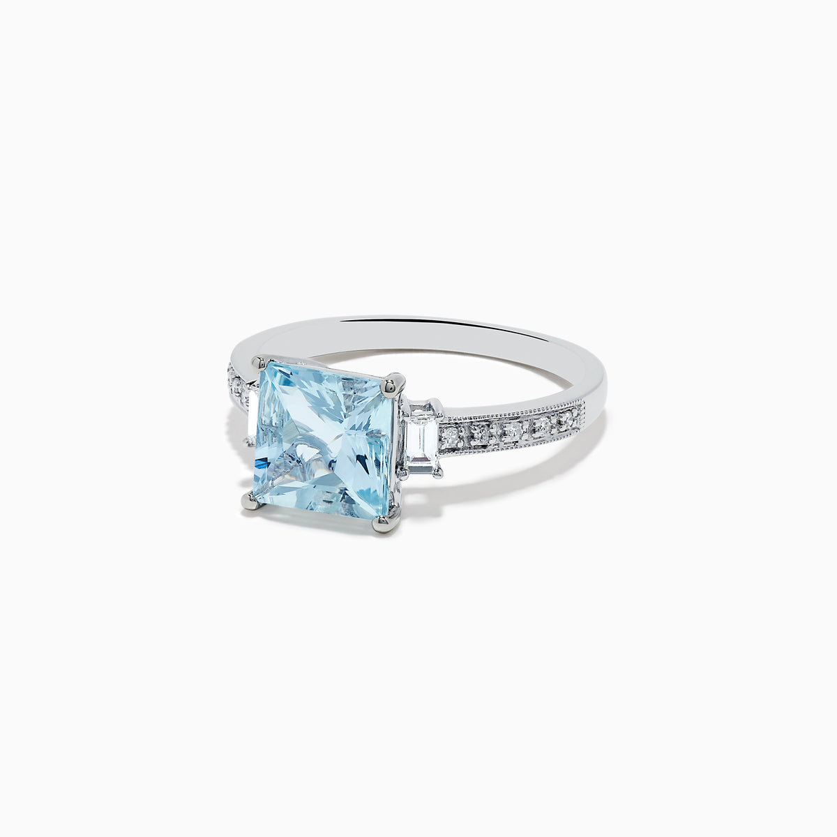 The Aquarius 14K White Gold Diamond and Aquamarine Ring showcases a square light blue aquamarine center, two rectangular clear side stones, and sparkling white diamond accents along the band.