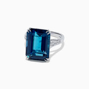 The Ocean Bleu 14K Gold London Blue Topaz and Diamond Ring, 15.14 TCW, features a rectangular emerald-cut topaz center and side diamonds, displayed against a plain white background.