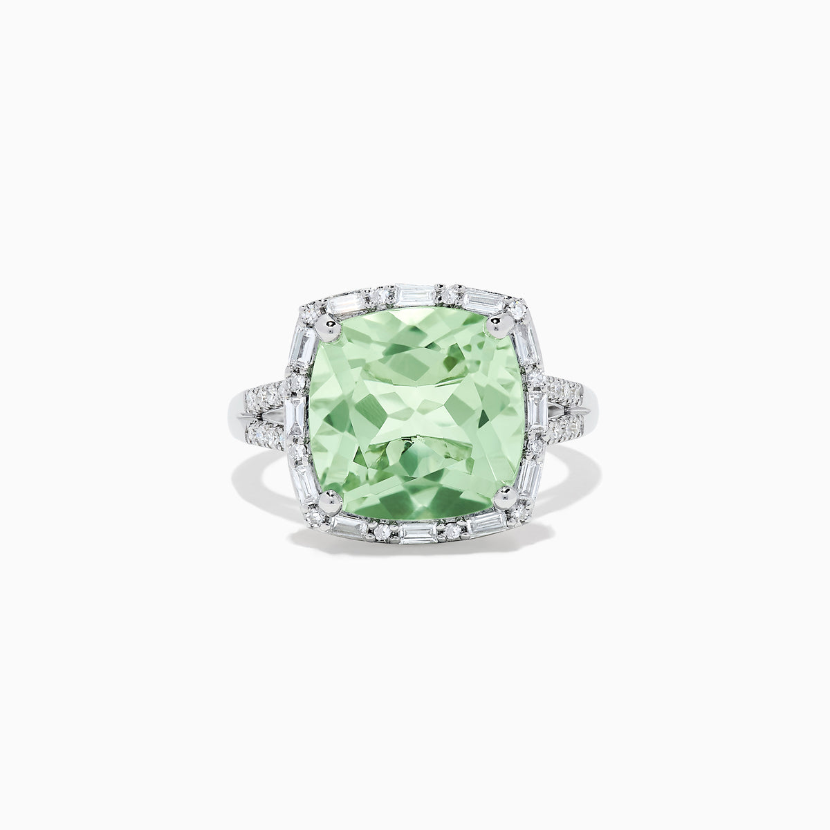 The 14K White Gold Green Amethyst and Diamond Ring showcases a cushion-cut green amethyst center, accented by a halo of clear baguette and round diamonds, all set in white gold.