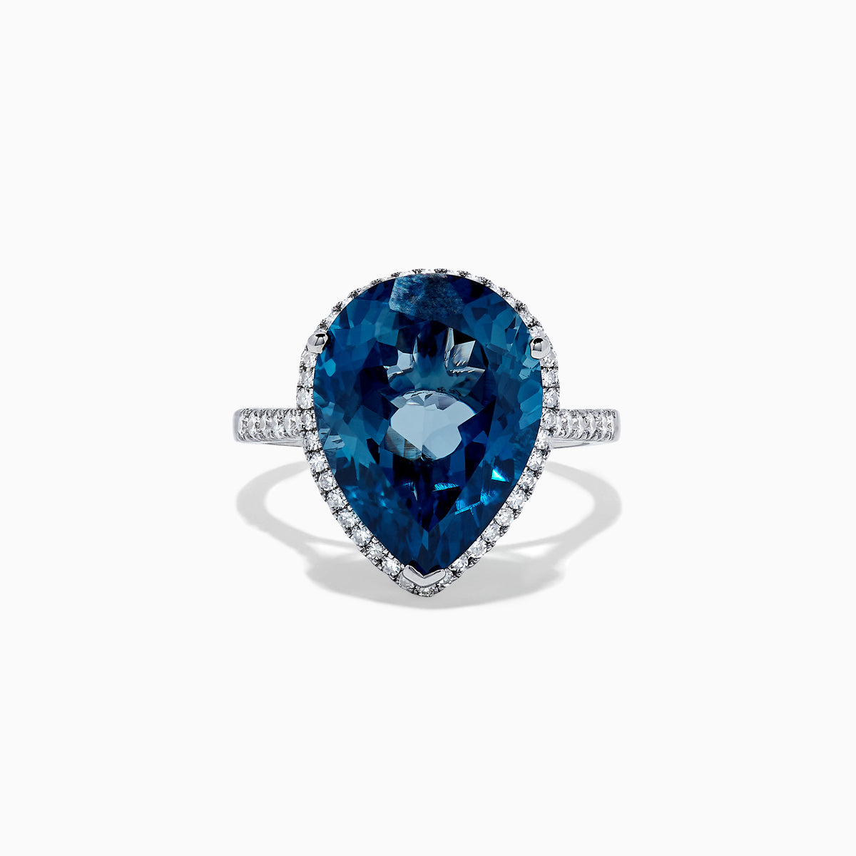The Ocean Bleu 14K Gold London Blue Topaz and Diamond Ring, 11.21 TCW, features a pear-shaped blue topaz with a diamond halo on a gold band, shown on a plain white background.