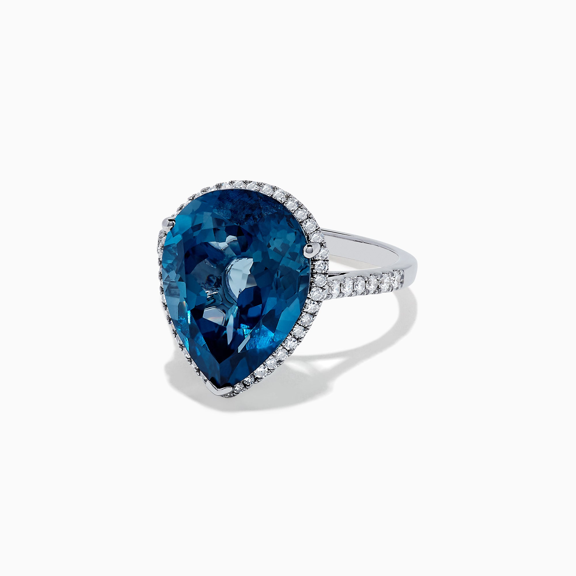 The Ocean Bleu 14K Gold London Blue Topaz and Diamond Ring, 11.21 TCW, features a pear-shaped blue topaz with a diamond halo on a gold band, shown on a plain white background.