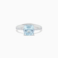 The Aquarius 14K White Gold Aquamarine and Diamond Ring features a cushion-cut aquamarine centerpiece accented by sparkling diamonds along the band.