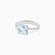 The Aquarius 14K White Gold Aquamarine and Diamond Ring features a cushion-cut aquamarine centerpiece accented by sparkling diamonds along the band.