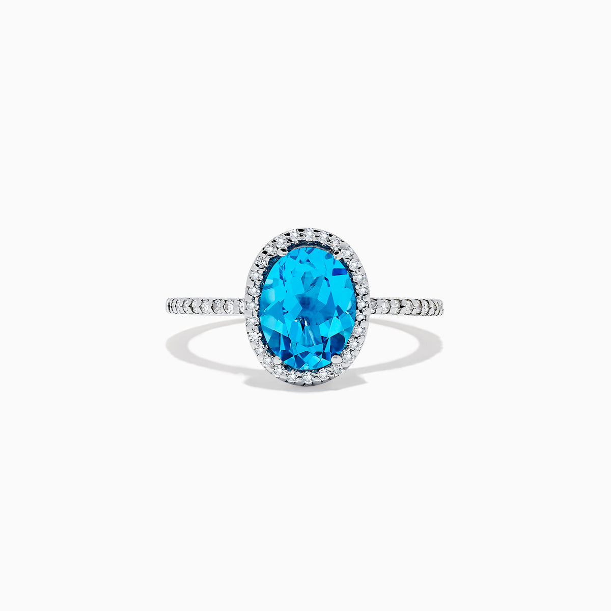 The Ocean Bleu 14K White Gold Blue Topaz and Diamond Ring, 2.51 TCW, showcases an oval blue topaz center with a diamond halo and additional diamonds along the band.