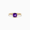 The 14K Yellow Gold Amethyst and Diamond Ring, 0.75 TCW features a cushion-cut amethyst center accented by round diamonds set into the band on each side.