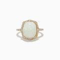 The Aurora 14K Yellow Gold Opal and Diamond Ring showcases a large rectangular opal center, surrounded by a halo of sparkling diamonds with additional diamonds adorning the band.