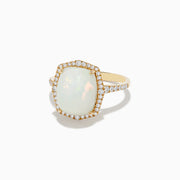The Aurora 14K Yellow Gold Opal and Diamond Ring showcases a large rectangular opal center, surrounded by a halo of sparkling diamonds with additional diamonds adorning the band.