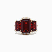The Bordeaux 14K Yellow Gold Garnet and Diamond Three Stone Ring, 8.62 TCW, features three rectangular garnets—the center stone larger than the sides—outlined by small round diamonds.