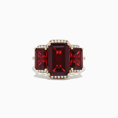 The Bordeaux 14K Yellow Gold Garnet and Diamond Three Stone Ring, 8.62 TCW, features three rectangular garnets—the center stone larger than the sides—outlined by small round diamonds.