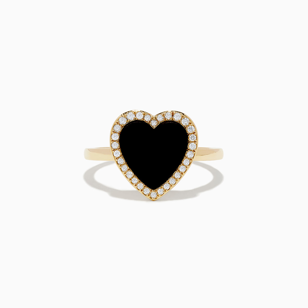 The 14K Yellow Gold Onyx and Diamond Heart Ring features a large heart-shaped onyx surrounded by sparkling diamonds, all set in yellow gold. Shown against a plain white background.