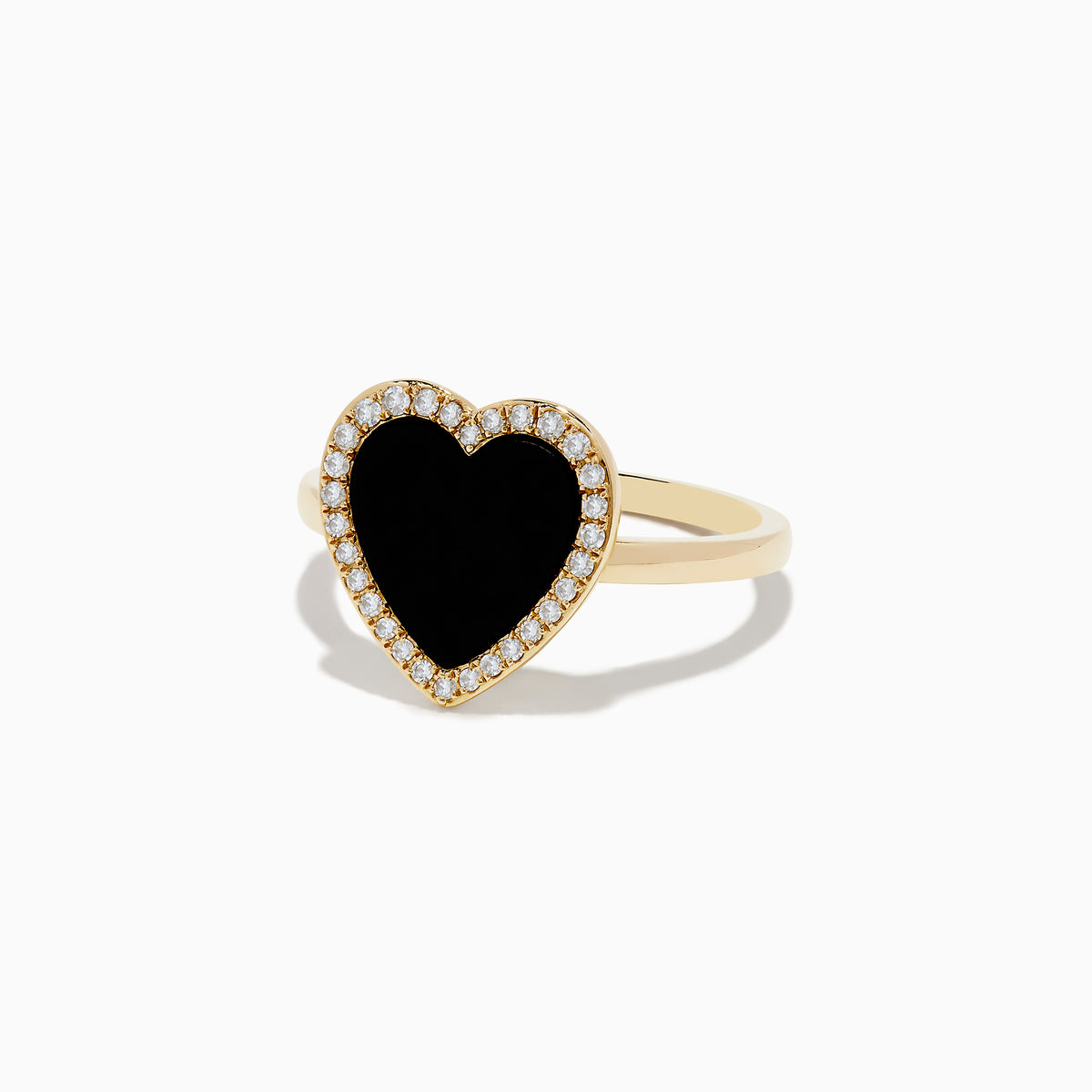 The 14K Yellow Gold Onyx and Diamond Heart Ring features a large heart-shaped onyx surrounded by sparkling diamonds, all set in yellow gold. Shown against a plain white background.