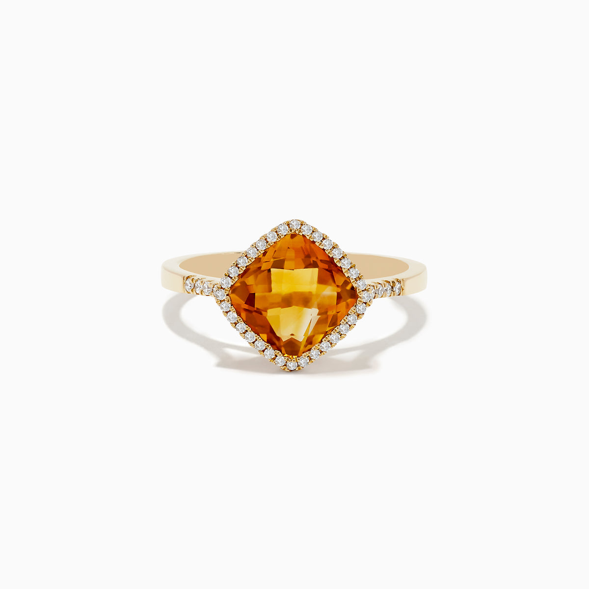 The Sunset 14K Yellow Gold Citrine and Diamond Ring features a cushion-cut citrine center stone encircled by a halo of sparkling white diamonds, displayed on a white background.