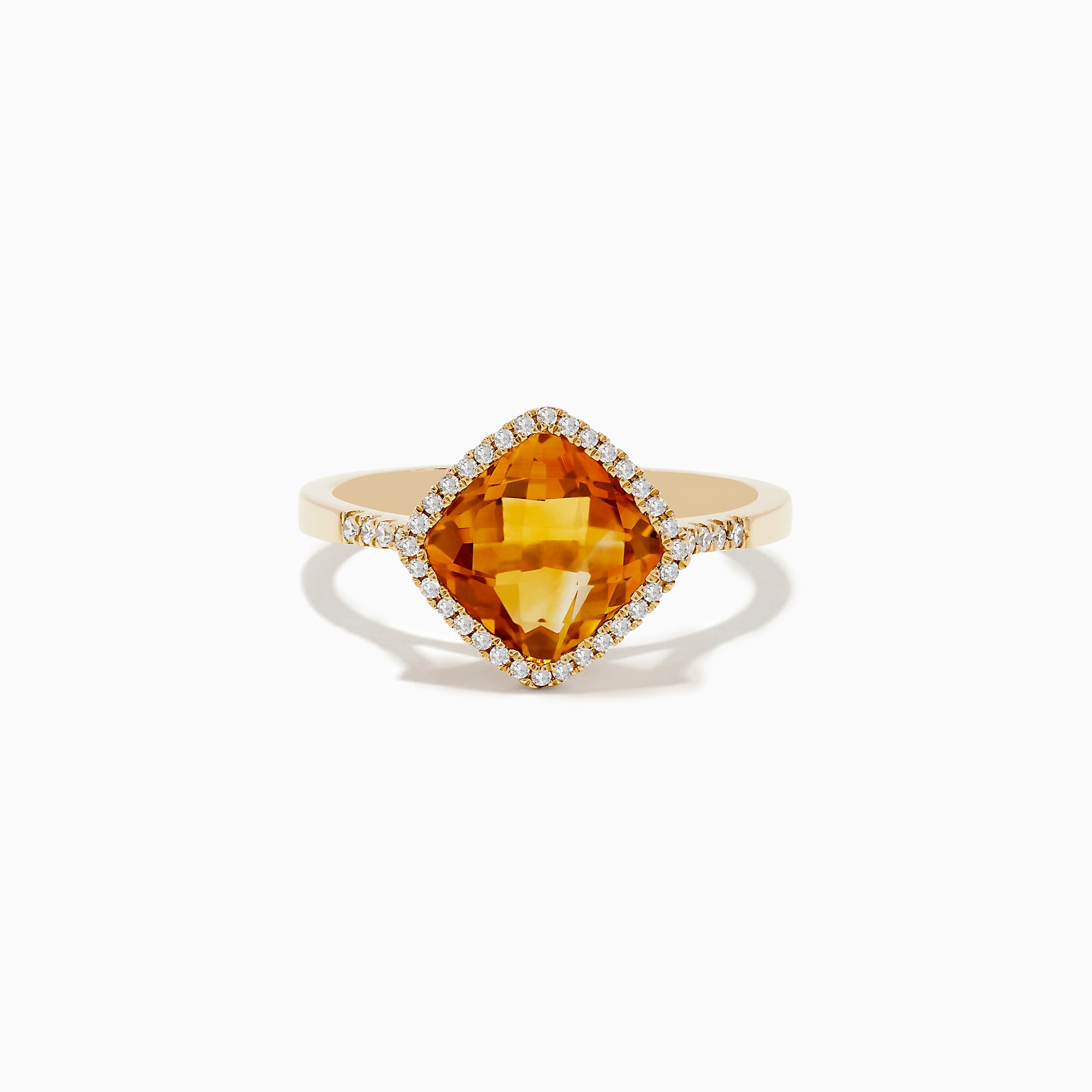 The Sunset 14K Yellow Gold Citrine and Diamond Ring features a cushion-cut citrine center stone encircled by a halo of sparkling white diamonds, displayed on a white background.