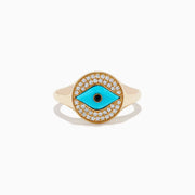 The Terra 14K Yellow Gold Turquoise and Diamond Evil Eye Ring features an eye-shaped motif with a turquoise center, a black pupil, and a border of sparkling diamonds surrounding the design.