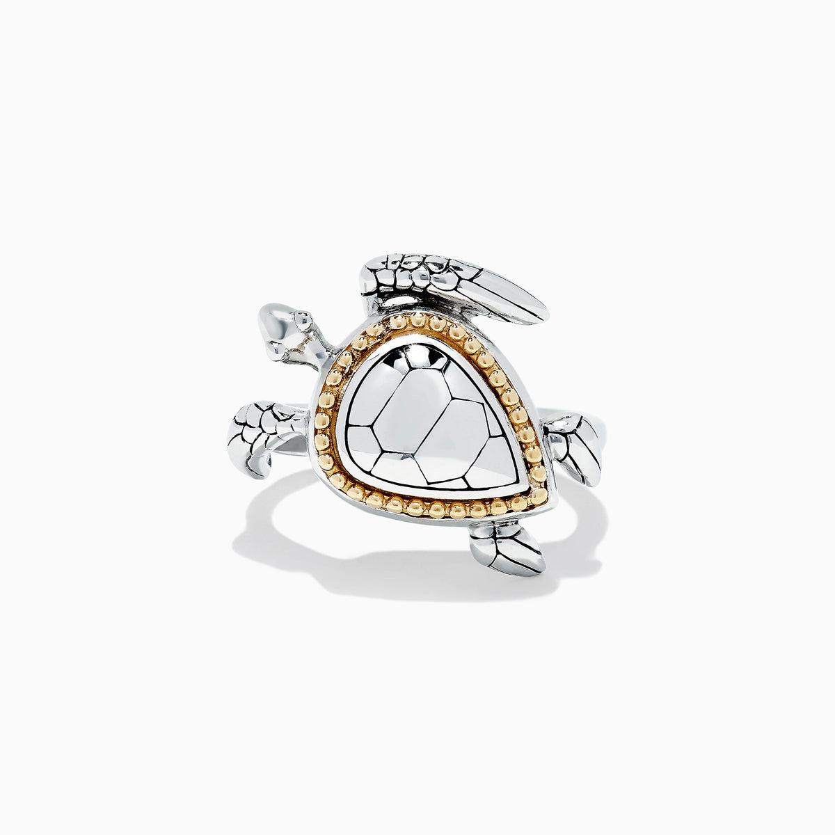 The Seaside Sterling Silver and 18K Gold Turtle Ring showcases a triangular shell-like centerpiece accented with gold beads, elegantly set against a plain white background.