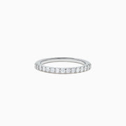 The 14K White Gold Diamond Ring and Matching Band Set, 2.00 TCW, features a large oval center diamond with a halo of round diamonds and a diamond-studded band—displayed against white, ideal for elegant bridal sets.