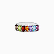 The Mosaic Sterling Silver Multi Gemstone Ring, 1.66 TCW, features a row of vibrant oval-shaped gems in red, green, orange, purple, blue, and brown set side by side across the band.