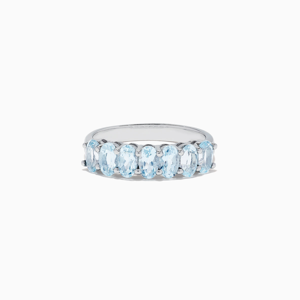 The Aquarius Sterling Silver Aquamarine Ring, 1.50 TCW, features a row of seven elongated oval light blue gemstones and is showcased on a plain white background.