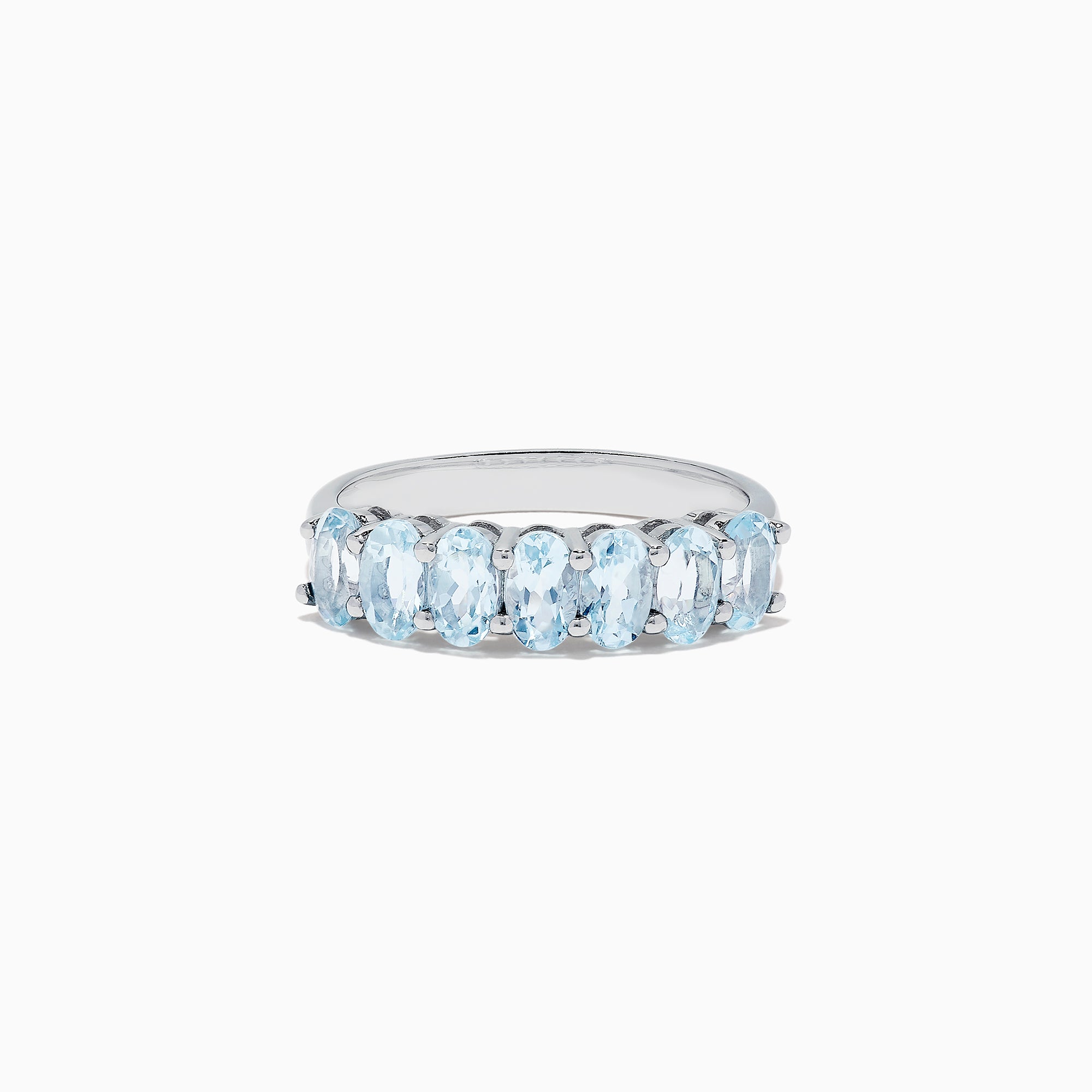 The Aquarius Sterling Silver Aquamarine Ring, 1.50 TCW, features a row of seven elongated oval light blue gemstones and is showcased on a plain white background.