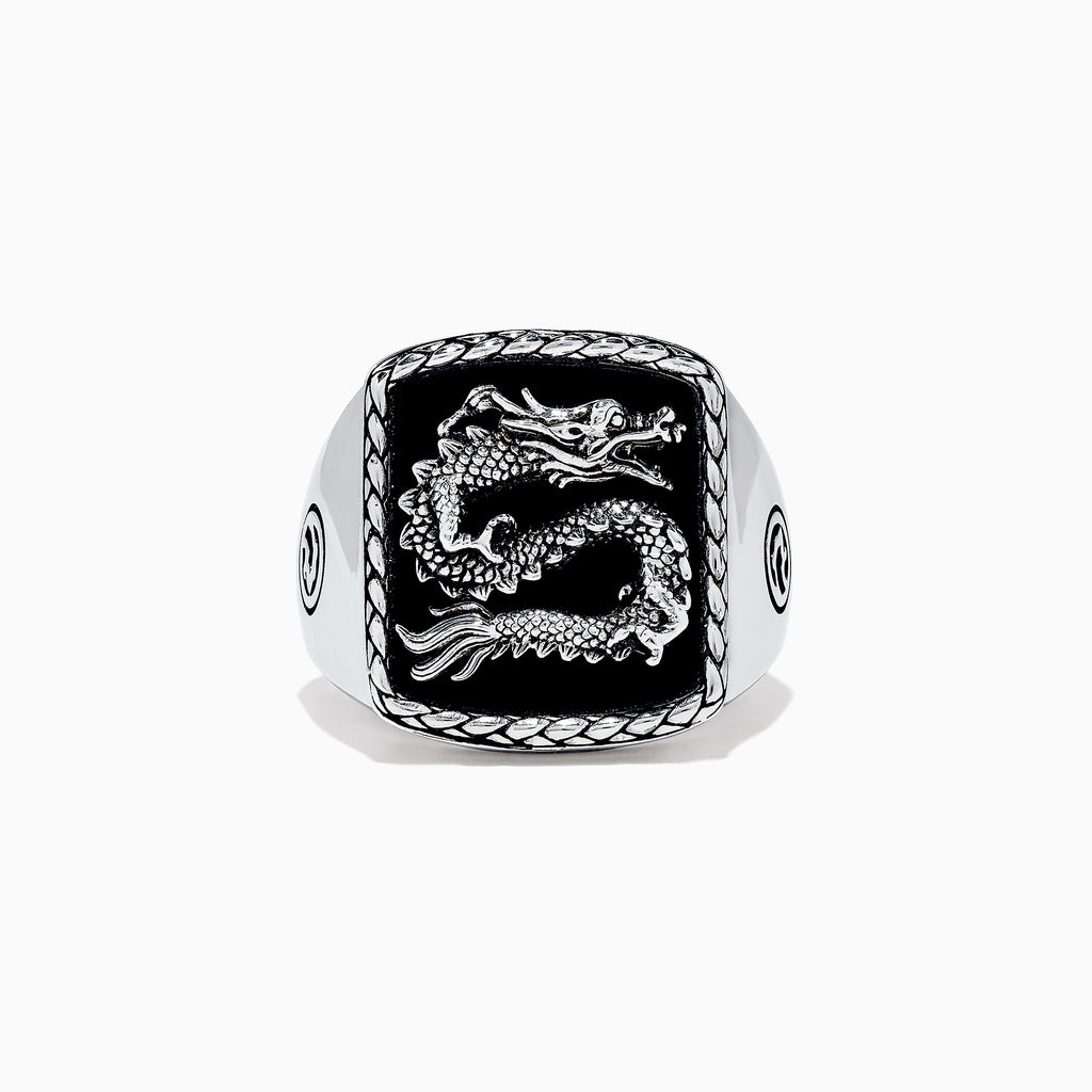 The Mens 925 Sterling Silver Onyx Dragon Ring, 5.00 TCWS, features a rectangular black onyx face with a raised dragon design, a textured border, and circular patterns on the sides.