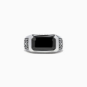 The Mens 925 Sterling Silver Onyx Ring, 4.38 TCW, features a large rectangular black onyx center with engraved geometric side patterns, displayed on a white background—a bold statement in mens jewelry.