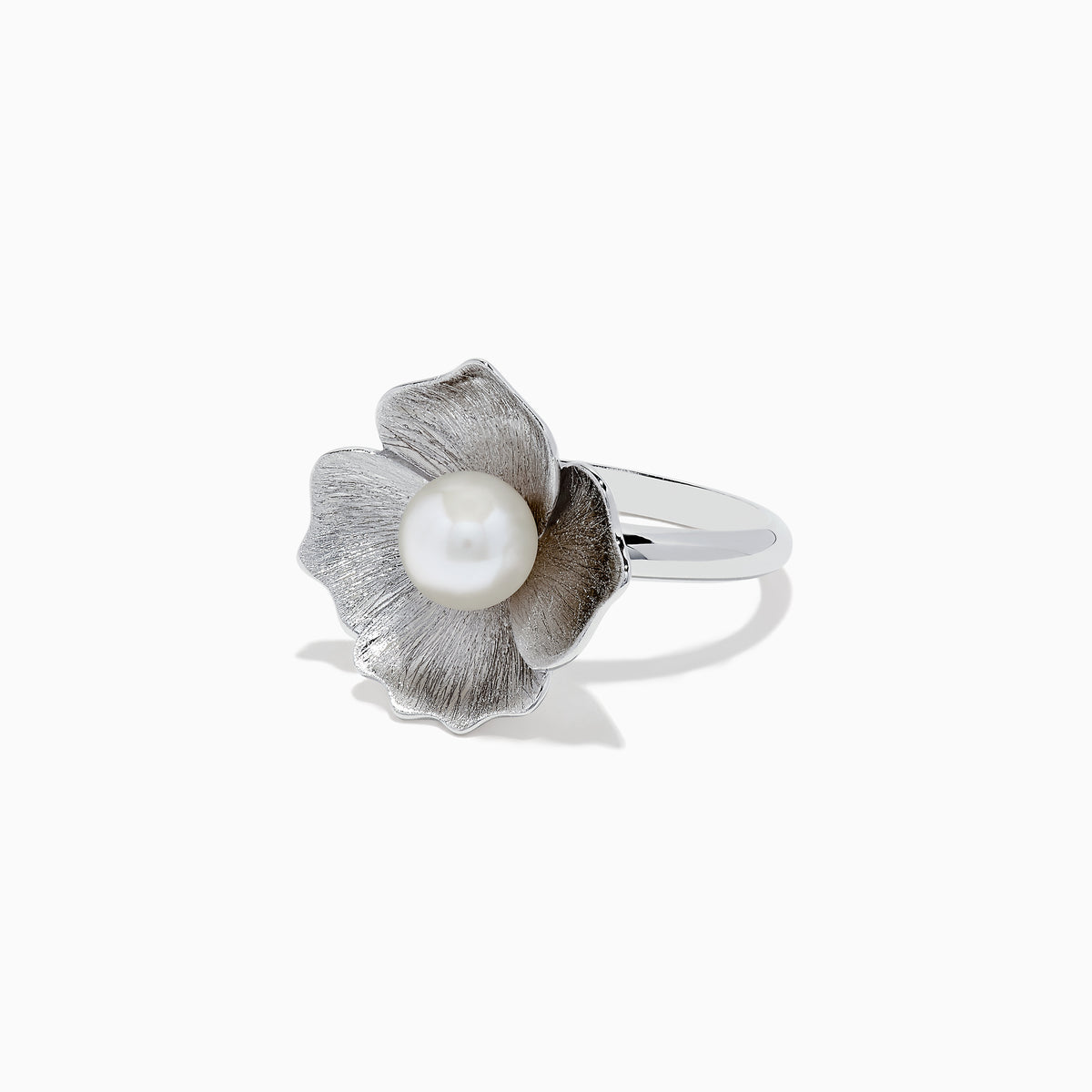 The 925 Sterling Silver Cultured Fresh Water Pearl Flower Ring features a textured floral design with a large round pearl centerpiece, shown against a white background.