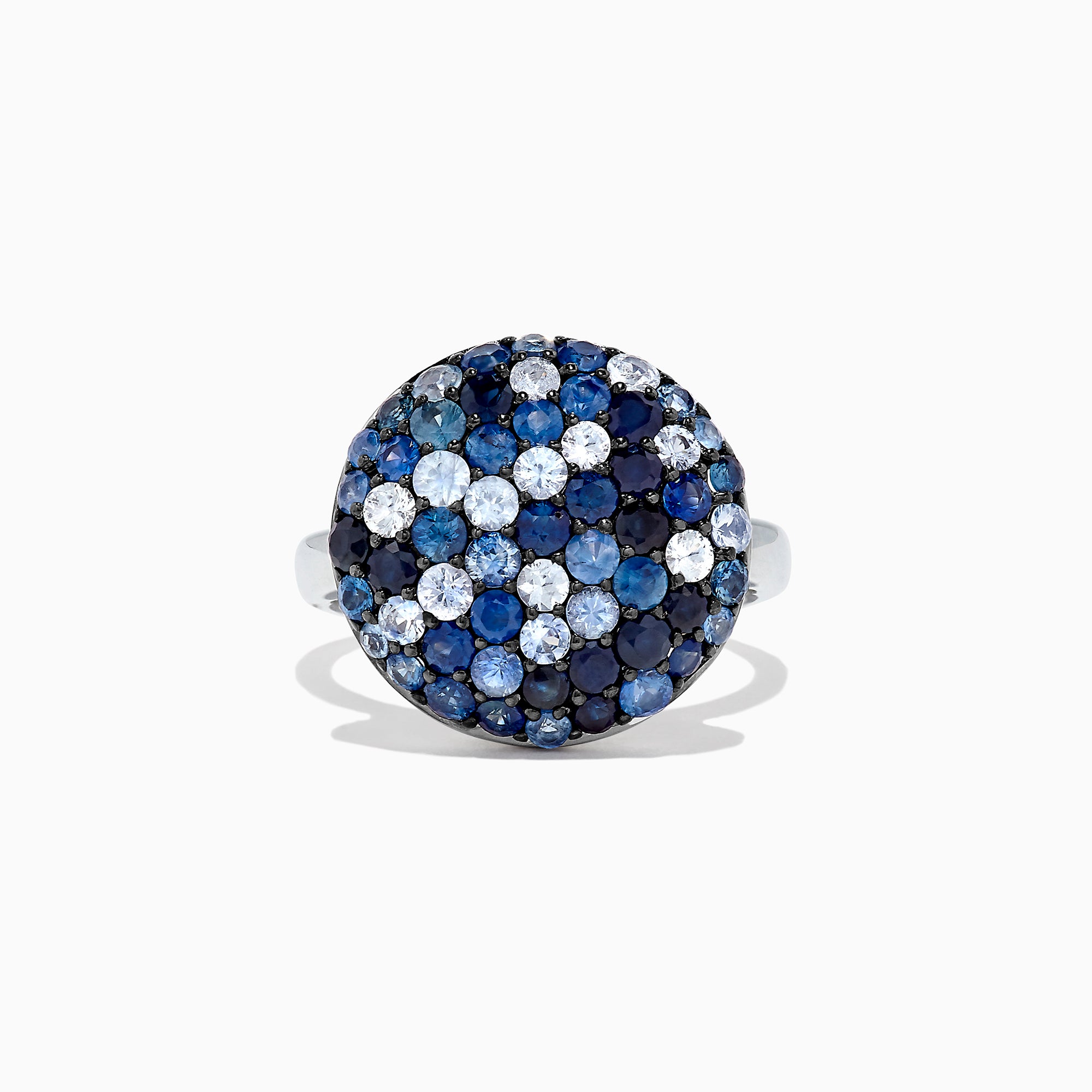 The Splash Sterling Silver Blue Sapphire Circle Ring, 2.95 TCW, features a round design with a domed top adorned with blue sapphires and white gemstones in a bold checkered pattern.