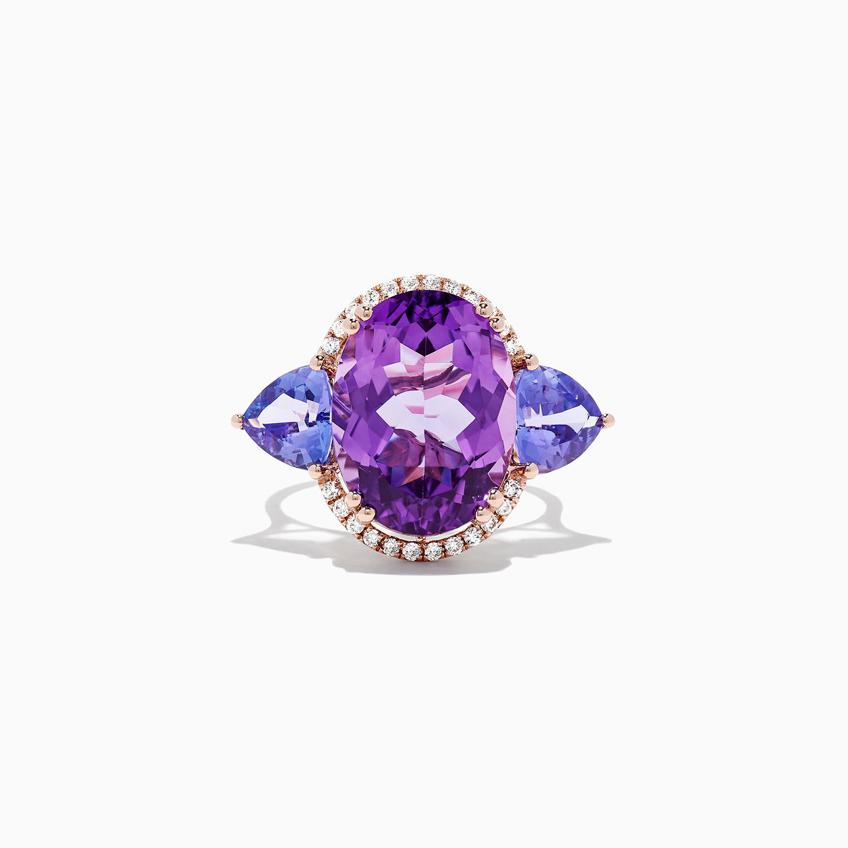 The 14K Rose Gold Amethyst, Tanzanite and Diamond Ring, 10.28 TCW features a striking amethyst center, accented by tanzanites and surrounded by a sparkling diamond halo.